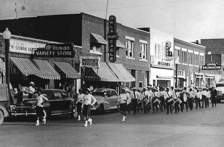 Greenwood Avenue with McGowan Variety Store, the Okla Eagle, and Dreamland Theatre visible along the strip